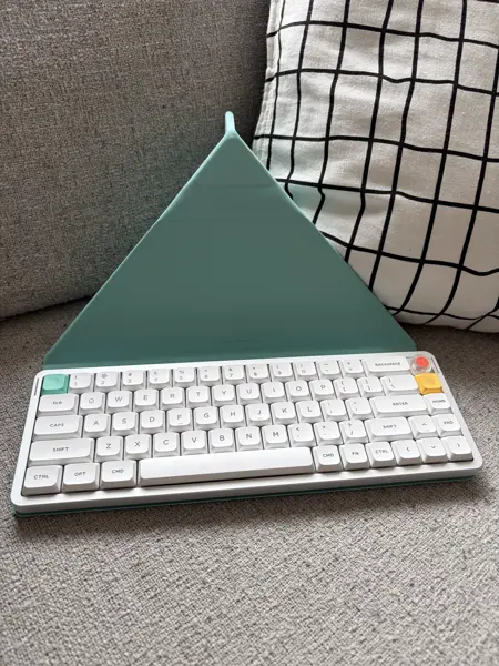 NuPhy Air V3 65 on the mint green folio cover folded into the tent mode ready for a tablet